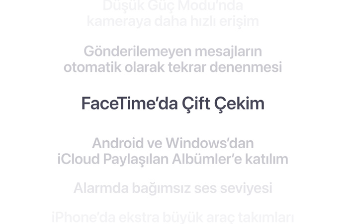 Dikey bir ?zellikler listesi, “FaceTime’da ?ift ?ekim” ?zelli?i ortada kal?n harflerle g?steriliyor. Etraf?ndaki di?er ?zellikler arka planda a?a?? ve yukar? do?ru silikle?iyor.