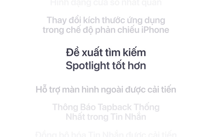 M?t danh sách các tính n?ng theo chi?u d?c, v?i “G?i y tìm ki?m Spotlight t?t h?n” ???c hi?n th? in ??m ? gi?a. Các tính n?ng xung quanh m? d?n vào n?n phía trên và d??i.
